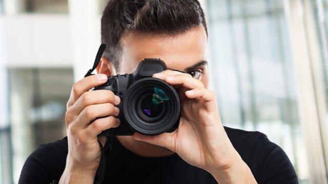 Photographer using his camera