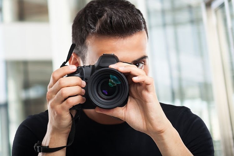 Photographer using his camera